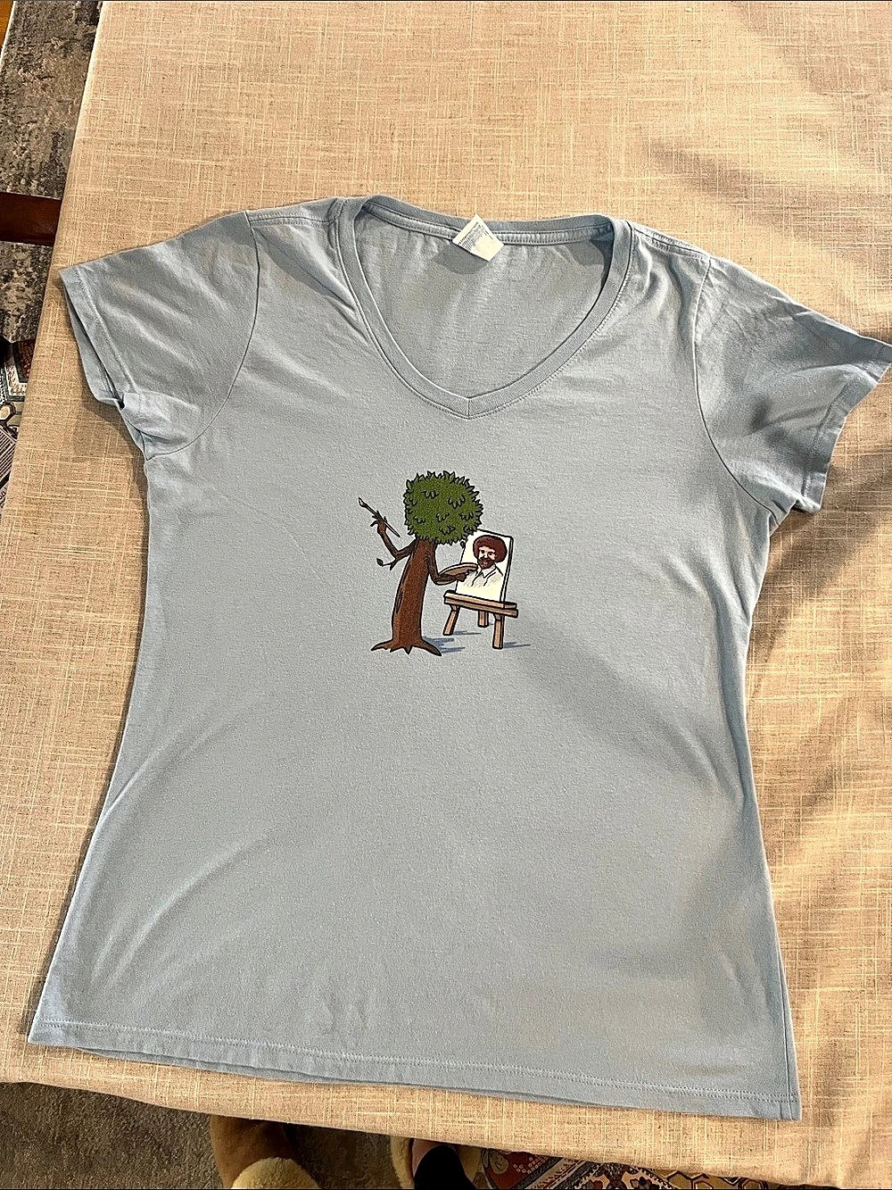 Port & Company”Bob Ross”
Fan Favorite V-Neck Tee Light Blue Size Medium